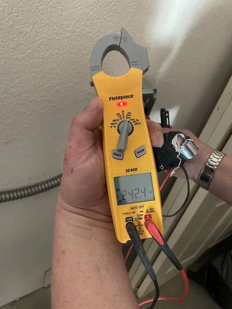 Voltage testing with clamp meter during Outlet Installation in Hopkinton